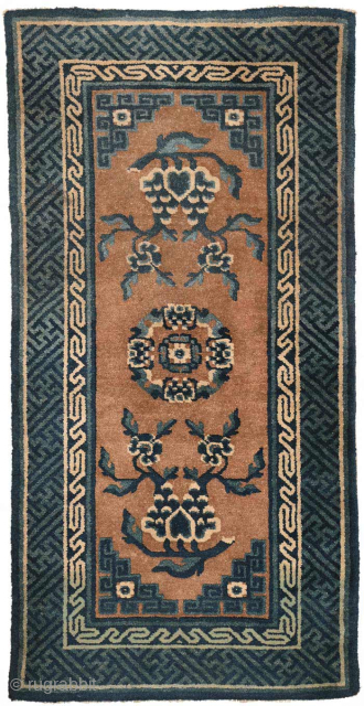 From the Baotou-Suiyuan / Inner Mongolian region of China, this carpet has an un-dyed brown camel hair coloured main field which the floral emblems and central medallion appear to float in. Made  ...