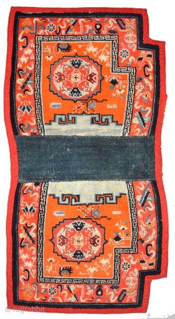 Tibetan under-saddle carpet or ‘makden’ joined (as is often the custom for this type of saddle carpet) in the center with a strip of naturally dyed blue nambu cloth and the back-side  ...