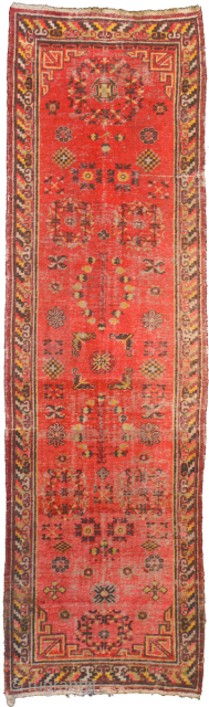 An uncommon 19th century East Turkestan runner (or ‘long narrow carpet’) from either Khotan or Yarkand - age old oasis towns on the southern branch of the ancient Silk Road - in  ...