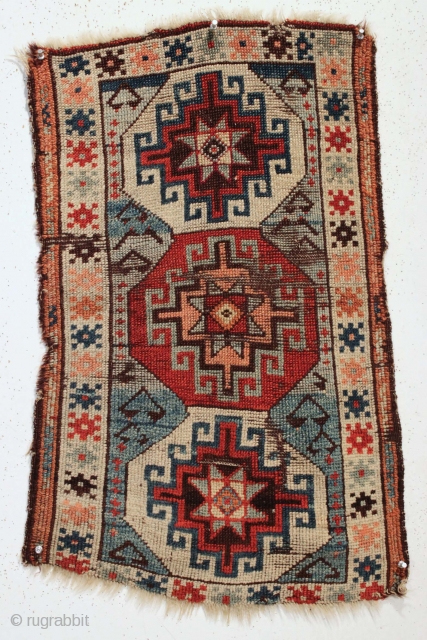 Antique Turkish yastik. Bold design. All natural colors with beautiful abrashed blue ground. Wear and edge loss. Clean. ca. 1880 or earlier. 21" x 31".        