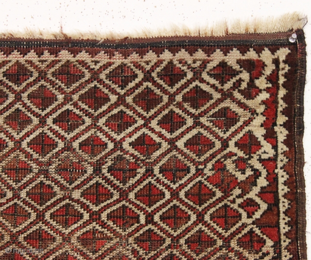 Antique tiny Baluch rug with an unusual allover design. All natural colors. "as found", with some wear as shown but original sides and ends. Reasonably clean with a small old stain as  ...