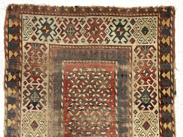 Early Kazak rug with a very unusual field design. The weaver created a novel eye dazzling “candy cane” lattice field and used traditional bold Kazak borders. All very good natural colors featuring  ...