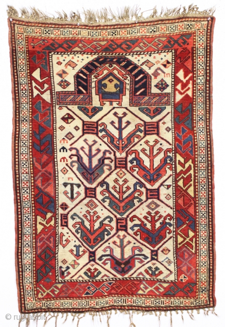 antique ivory ground small kazak prayer rug. Good condition with original braided ends and selvages. Unusually dramatic large scale lattice with graceful tulip palmettes and very interesting borders. All natural colors featuring  ...