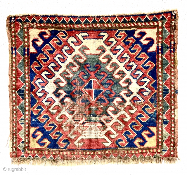 Antique bagface, possibly an uncommon Caucasian Kazak example. Interesting latch bold hooked design similar to what one might find on a Kazak rug. Fair pile with some wear as shown. All good  ...