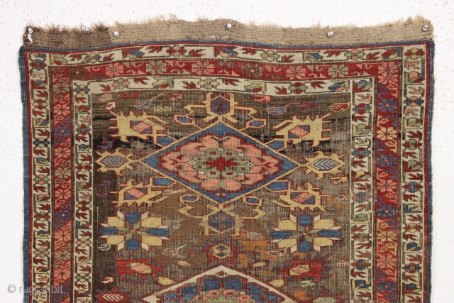 Antique caucasian kuba soumak long rug. Great yellows and greens. Original sides and end finish. The heavily oxidized brown ground has areas poorly filled in and should be restored. The design elements  ...