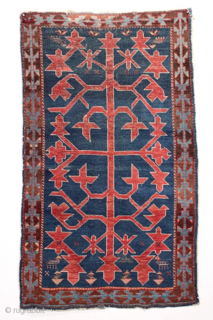 Antique caucasian Avar rug with iconic design. Overall mostly even low pile with scattered small old repairs, not very well done. Original selvages. Ends rough. Colors appear natural other than some bright  ...