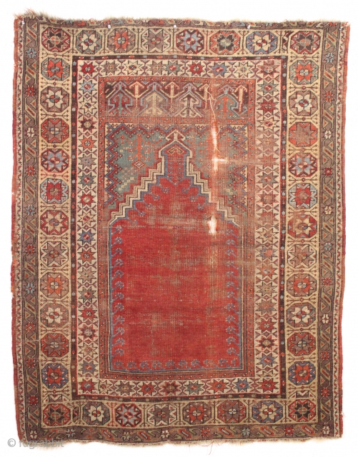 antique mudjar prayer rug. Older example, as found, very dirty with wear and damage as shown. All natural colors including a nice old green. Good age, ca. 1860. 4' x 5'1"  