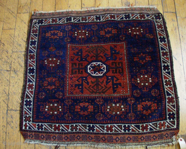 Antique baluch bagface. High quality weaving with good lustrous pile. All natural colors. Nice medium blue. 19th c. piece. 2' 9" x 2' 11"         