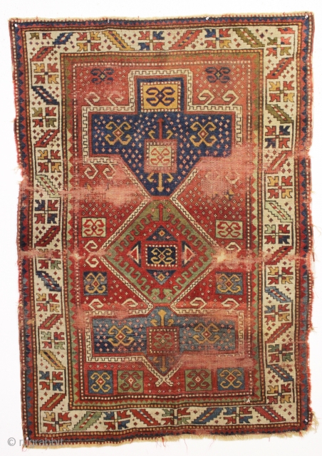 antique kazak rug. Fresh New England find. Strong design and all natural colors featuring nice yellows and greens. As found, very dirty with heavy wear and scattered damage as shown. Has good  ...