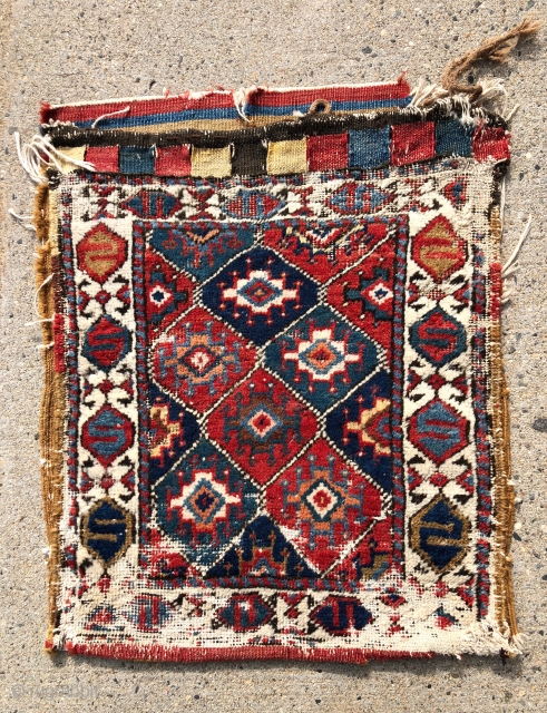 Antique complete northwest Persian bag with some unusual design features and great color. Unfortunately in rough condition. The  uncommon field of “memling” or turreted guls and extra wide ivory border with  ...