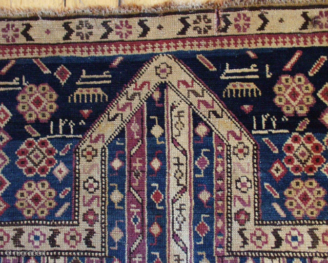 Antique small caucasian prayer rug, probably Karrabaugh. Appears to be dated in the spandrels. Interesting "cane" design field. Mostly good pile. Some minor wear, edge loss. Unusual but all natural colors. As  ...