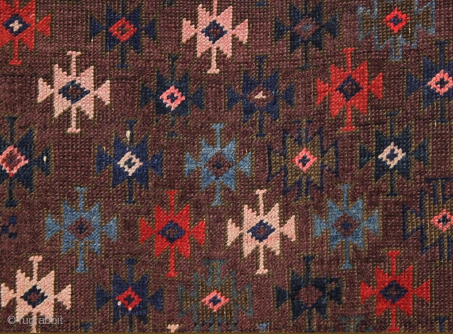 antique baluch rug with very intense color and highest quality weave. Uncommon design. Symmetrically knotted with typical use of many vibrant hues. Probably a synthetic pink. Good even pile with fine weave  ...