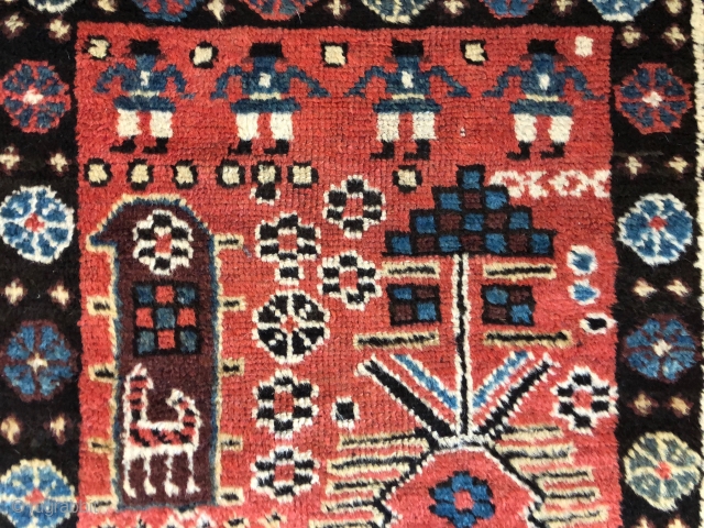 Antique Persian tribal runner with many charming animals and folky human figures. Probably Luri or Kurdish. Pile mostly good thick medium length with some scattered field areas low and worn as shown.  ...