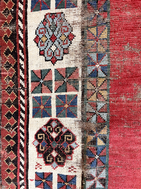 Early Caucasian rug with some usual and some unusual design features. Talish group long narrow format with iconic endless knot and “dice” elements. The additional quirky field decoration makes this a unique  ...