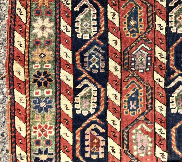 Antique small Caucasian rug with an interesting design and attractive old colors including pretty greens. This column design and the cochineal purple pile indicates karrabagh but the weave looks more south Caucasian?  ...