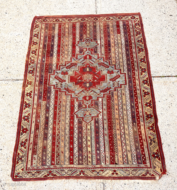 Antique Turkish village rug with attractive cane design field. Kirshehir area? Overall pretty good condition although dirty and very much in need of a good wash. Mostly even low pile with scattered  ...