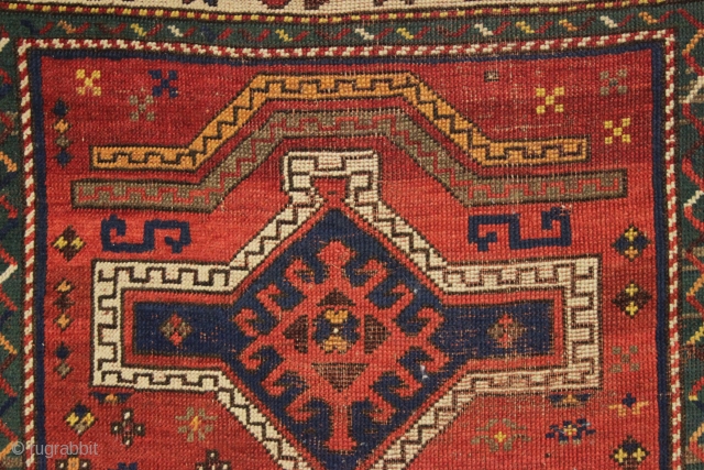 antique small kazak prayer rug with an unusual pair of floating arches. I've never had one like it. Overall fair condition for the age with all natural colors. And yes the orange  ...