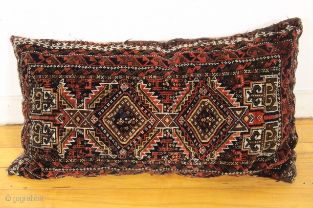 antique baluch balisht. A pillow made into a pillow. Good pile and good colors. Phat as found. Late 19th c. about 14" x 31"         