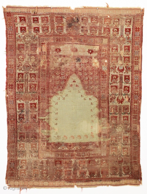 Early anatolian prayer rug. Very rough condition but not a very large cost. Old faded repairs. ca. 1820 4'2" x 5'6"            