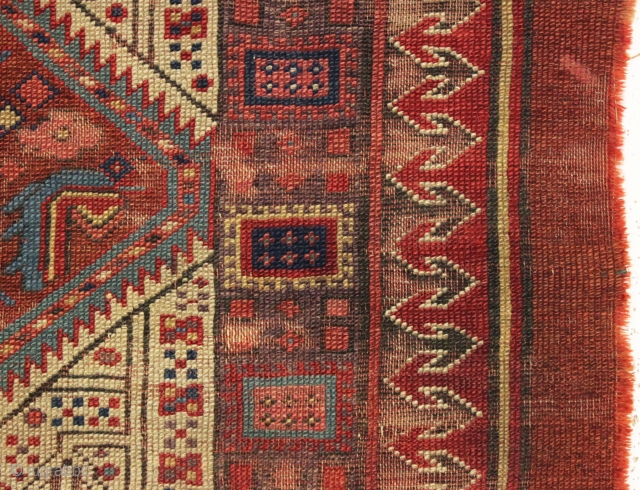 early nw persian rug with eye catching drawing and beautiful old colors. Multiple reds, light blues and a fine old purple. Complete but very much abused with areas of heavy wear and  ...