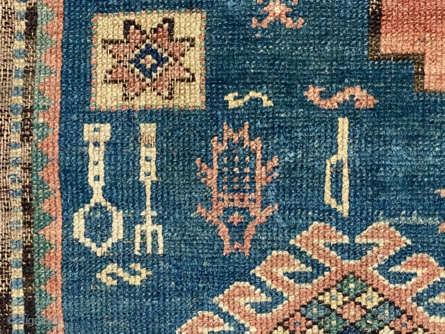 Yikes! Fork, spoon and knife? A fish? Antique Kazak rug in very poor condition with classic field and borders. Wear, holes, edge loss. As found, very dirty. Hard to be sure but  ...