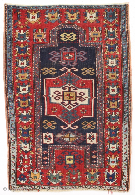 antique small kazak prayer rug. Unusual field ornamentation and a striking light blue border. If palmettes are your thing this is the rug for you. All natural colors including an unusual yellow/gold.  ...