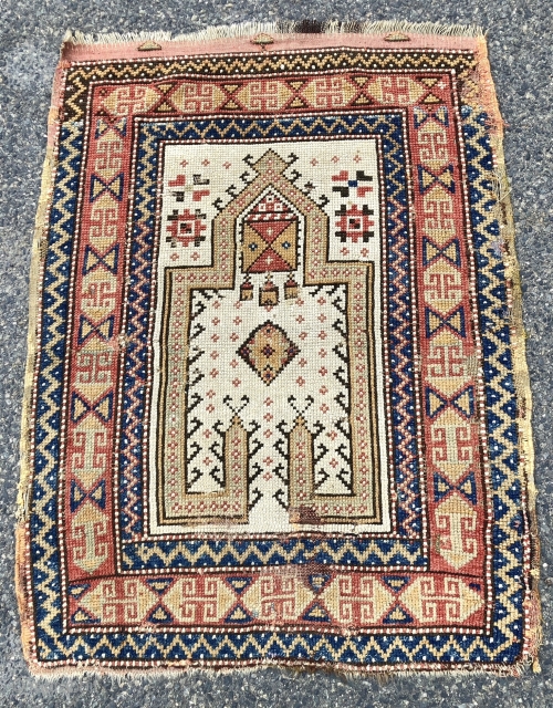 Antique Anatolian ivory ground prayer rug, likely Manastir origin. Lovely archaic drawing and characteristic use of lighter Manastir natural colors. Intact with remnant original selvages and kelim at top. Scattered small old  ...