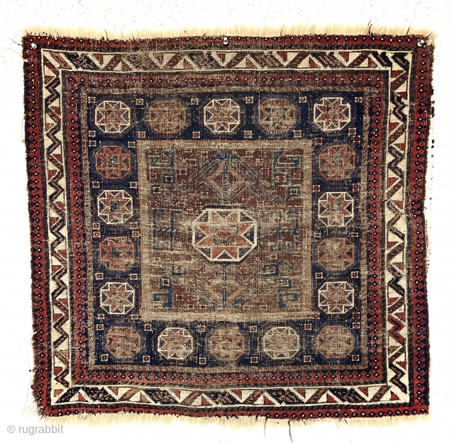 Ghostly but friendly old Baluch square middle bagface. I like the border. 19th c. 
2’7” x 2’10”                
