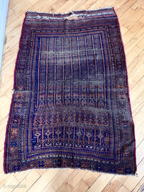 Antique little Baluch rug with an unusual, perhaps unique design. Has wear and small damages. Time to empty the cedar chests. 19th c. 3’7” x 5’5”       