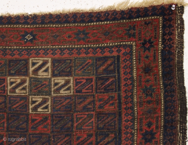 antique baluch rug. Something of an unusual design with all those z's. All good colors with some camel wool pile. "as found", very dirty with wear and old patch as shown and  ...