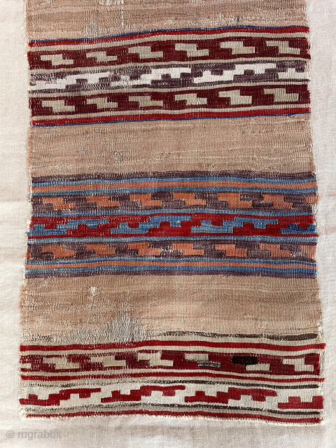 Early Anatolian kelim fragment. Attractive striped design. Sewn onto cloth backing. Lovely old colors. Mid 19th c. or earlier. Kelim  22” x  68” waynecbarron@aol.com       