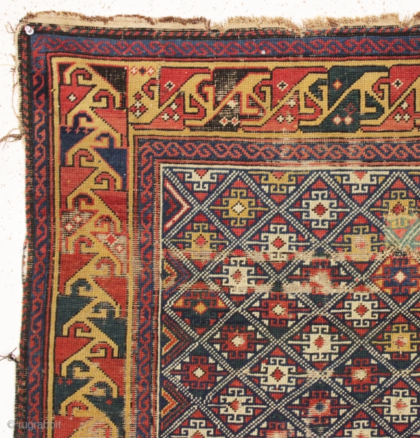 antique very small caucasian shirvan rug with an unusual design and a lovely yellow border. Very fine weave. Supple, cloth like handle. As found, with mostly even tight pile, some scattered wear  ...