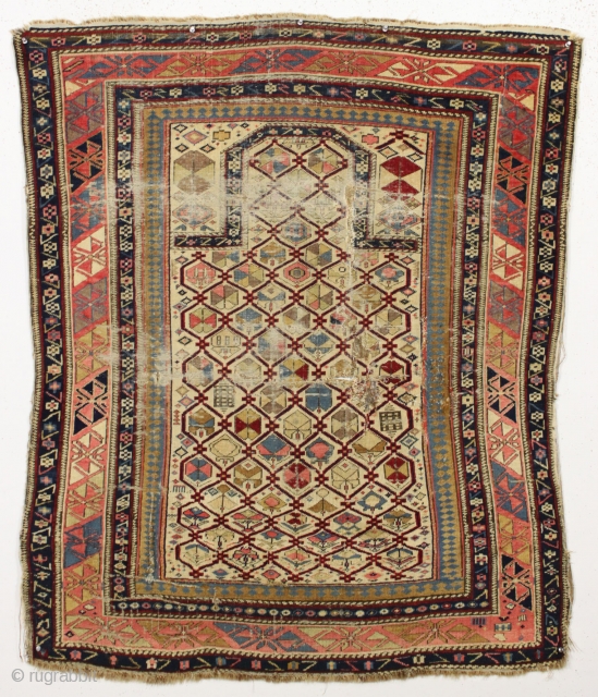 Antique early ivory ground prayer rug. Not your typical cookie cutter example.   Unusual in palette and drawing. Very saturated natural colors featuring a rich deep red and an intense natural  ...