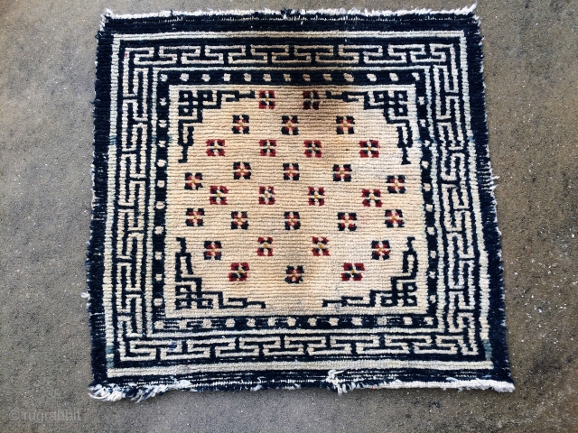 19th Century Tibetan Sitting Rug.  35 x 28", Has not been washed but note stain or singe. Note uncommon design for a collector.  Purchased in 1990 while on a trip  ...