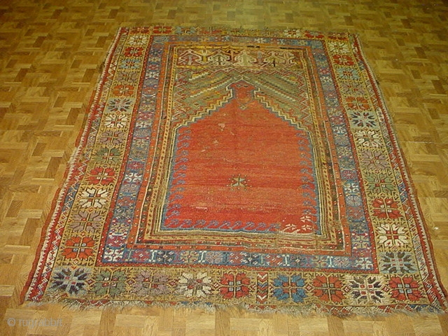 Early Turkish Prayer Mudjar rug,size 4ft. 5ft 4 inches, circa 1850. This rug is in good condition, missing last outer guard borders, some older repair and patches.      