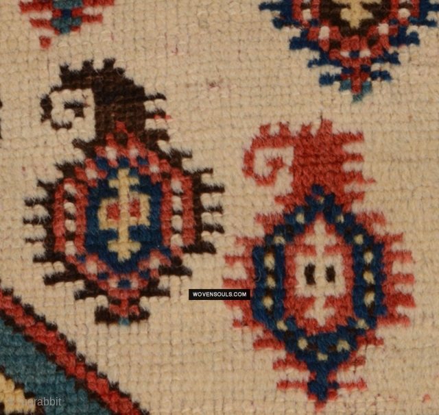Exquisite boteh & birds on an old Kazak fragment. High pile, good colors. Ends missing. Enjoy more photos and description here: https://wovensouls.com/products/1718-antique-white-field-kazak-village-rug-with-birds-boteh

           