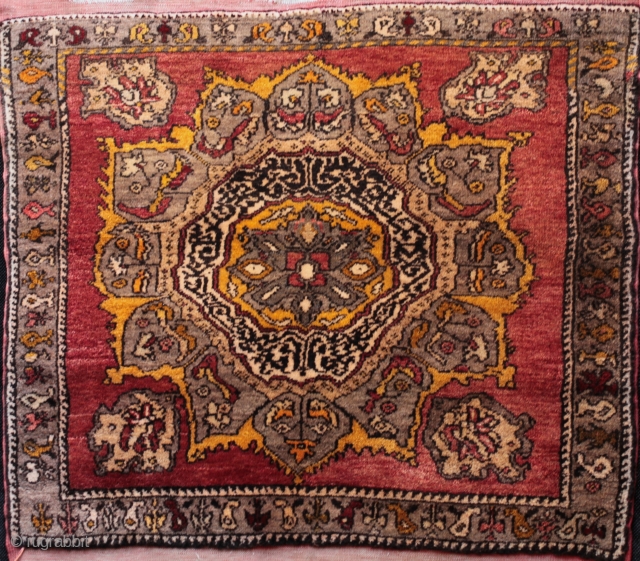 Unusual size central Anatolian nomadic sitting rug about 4 foot square from Yeşilhisar in Kayseri province.

 Well drawn with interesting Ottoman Osmanli motif in the centre and a quirky boteh border. 1st  ...