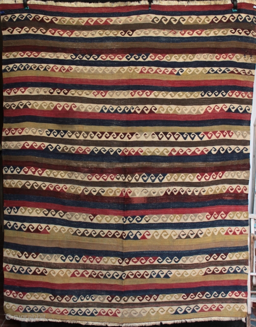 Old Cubuklu kilim from Mugla Province, Anatolia with repeated meander motifs with a Hokusai wave look, also interpreted as yin yang motifs but actually originating from the architectural patterns from the Greek  ...