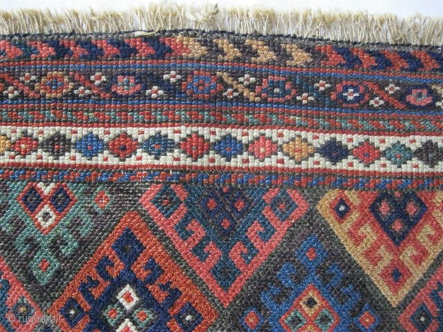 (127)Jaff Kurd pile panel-mid 19th C.57X54 cm
-see Tribal Rugs MacDonald plate 118 for similar. 

All vegetal colors (11)-including emerald green, aubergine, etc.Low pile, overcast sides, repaired closure slits.spot tinting.


price inc. shipment to  ...