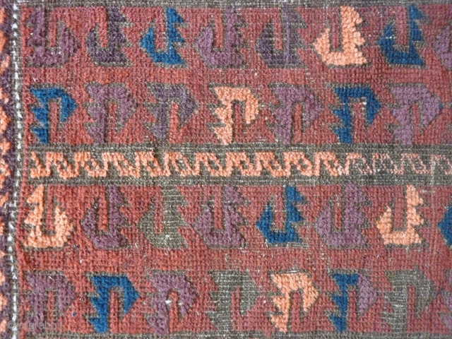 Old Baluch rug of a rare type. 
Complete with skirts. Damages to the selvedges and some wear in the field. Extraordinary complex border and appealing field including some aubergine color.
144cm x 85cm

 