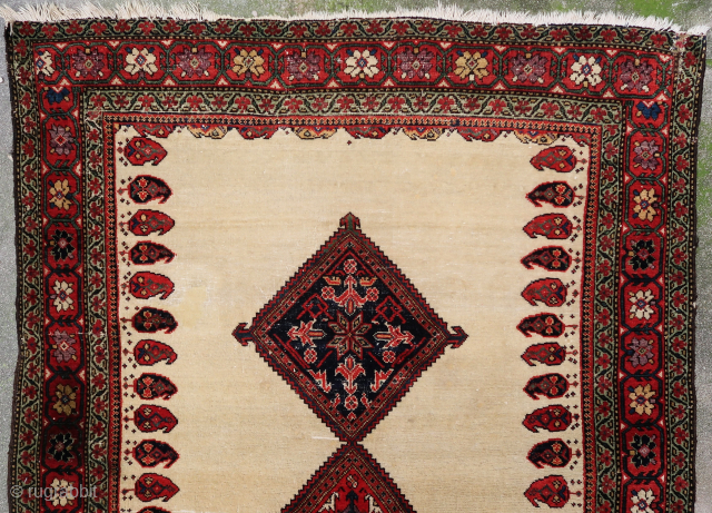 Unique, old and colorful 19th c. Farahan rug (190 cm. x 120 cm.) Lovely piece with soft wool and beautiful dyes on an ivory field. There's a reweave (see last picture), sides  ...