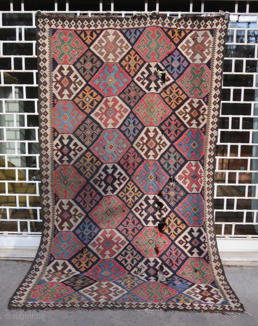 Old, rare, and colorful complete Azerbaijan Kilim for a resto project (284 cm. x 177 cm.) Extraordinary dyes and playful visual schema. In need of a skillful restorer or just a good  ...