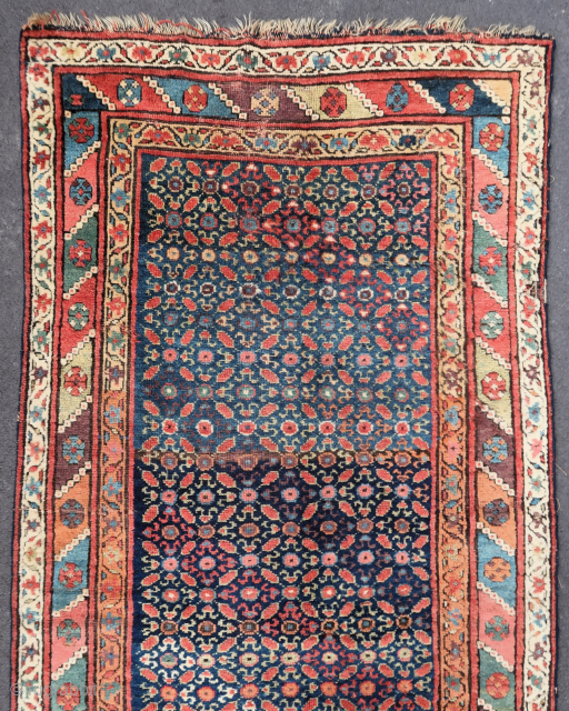 Old and colorful kurdish rug (119 cm. x 245 cm.)
A riot of colors, with good high pile almost everywhere.
In need of a good wash, few moth damages, slight localised wear on the  ...