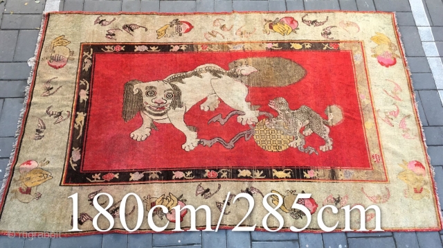 Chinese Xinjiang rug, red background with  little lion pattern, fruit veins selvage, the pronunciation of “tai Shi”, means an official position in ancient China. Good age and condition. Size 180*285cm(70*111”)  