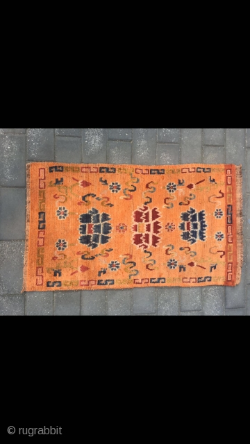 Tibetan rug, orange color with Buddha eight treasures pattern. Wool warp and weft. Size 145*73cm(56*28”)                  