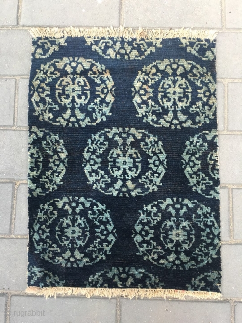 Tibetan rug fragment, blue background with white group flower pattern.  good age and condition. Size 74*57cm                