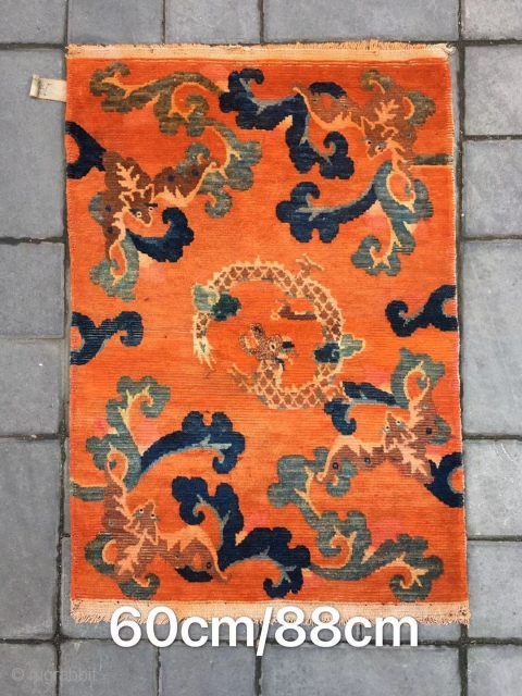 betan rug, Orange background with bat pattern, surrounded by the bat 
veins. Very nice rug, good age and condition. Size 88*60cm(34*23”)            