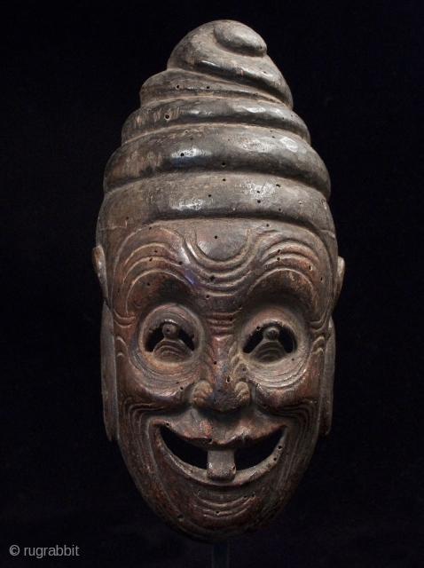 Qintong the Buffoon, Nuo Mask, China.
Wood mask, bronze base.
10.5" (26.5 cm) high by 5" (13 cm) wide.
Mid 19th century or earlier.            