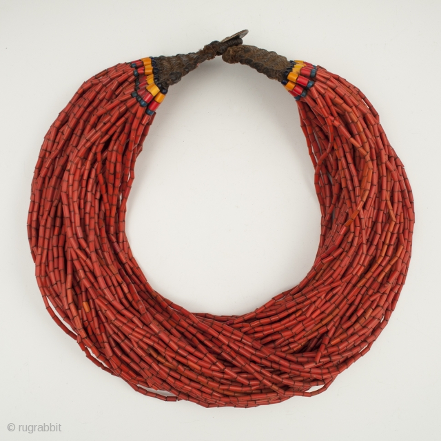 A nice, full multi-strand beaded necklace, Naga people, Northeastern India. Old glass beads, bronze disc, cotton string, 19" (48.2 cm) long. Early to mid-20th century.        