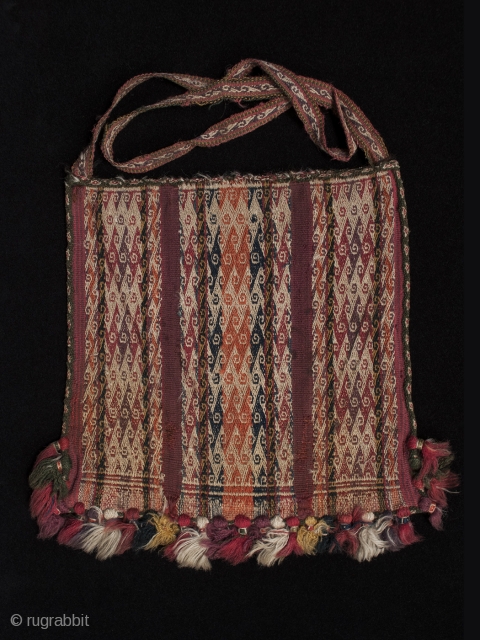 Chuspa (coca bag),
Department of Potosi, Bolivar Region, Bolivia.
Wool, natural dyes,
Late 19th century,
9.5" (24 cm) high by 8.5" (21.5 cm) wide

Plain weave coca bag, with double-faced weave pattern bands using complementary warp sets. 